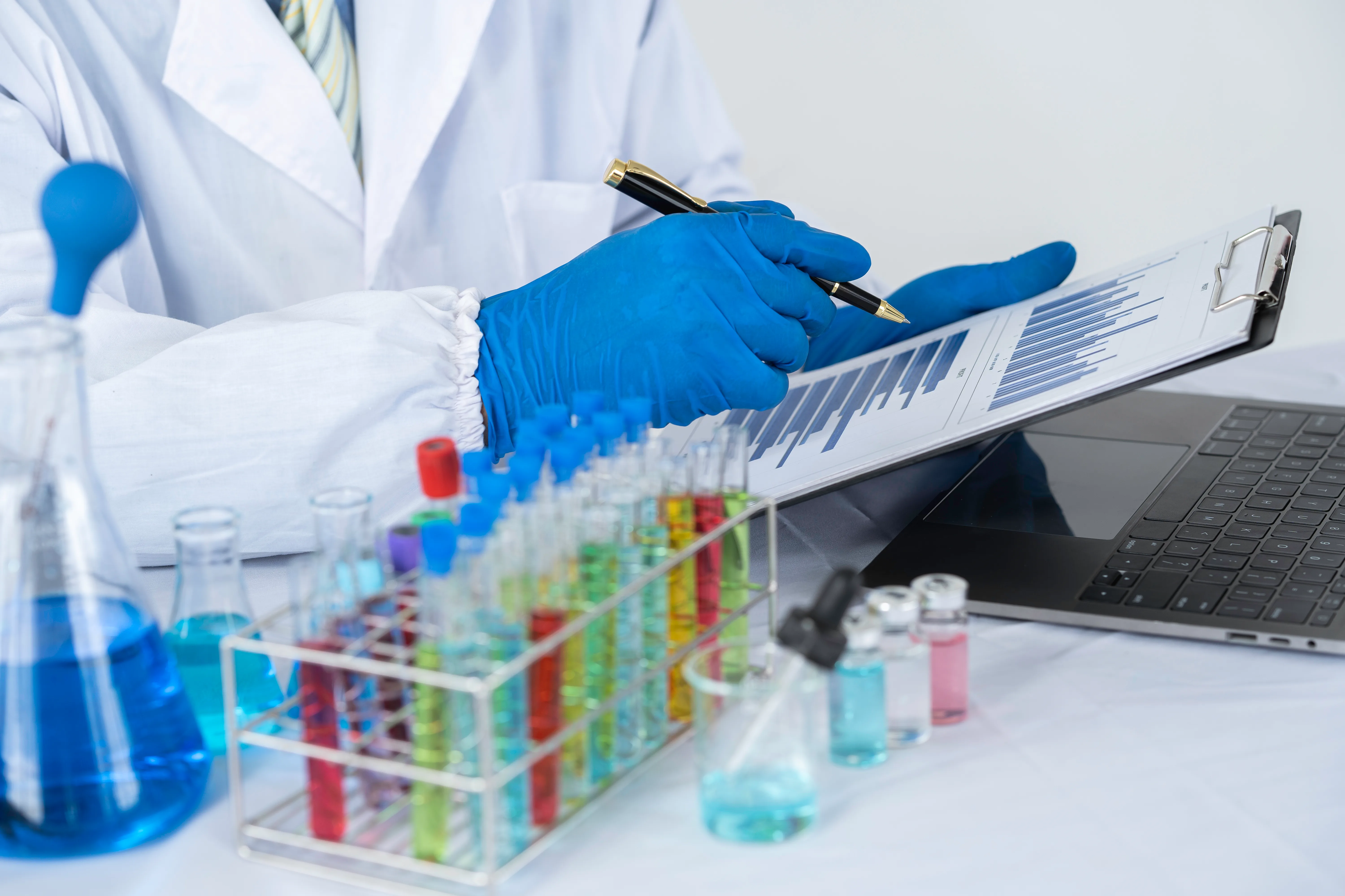 chemical researcher, scientist Analysis is taking notes on the results of the experiment. with multi